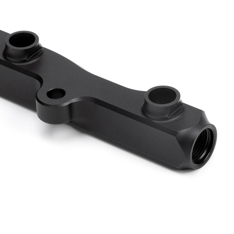 Detail view of ports on Fuel Rail in Satin Black Anodized Finish for Honda K-Series 